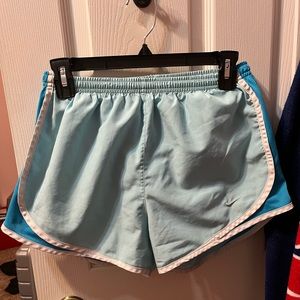 Nike teal and light blue running short. Size small. Look brand new.